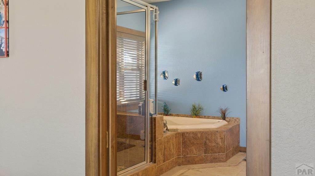 415 Riata Drive Trinidad, CO 81082 - Photo 27 of 61 a bathroom with a granite countertop sink and a mirror