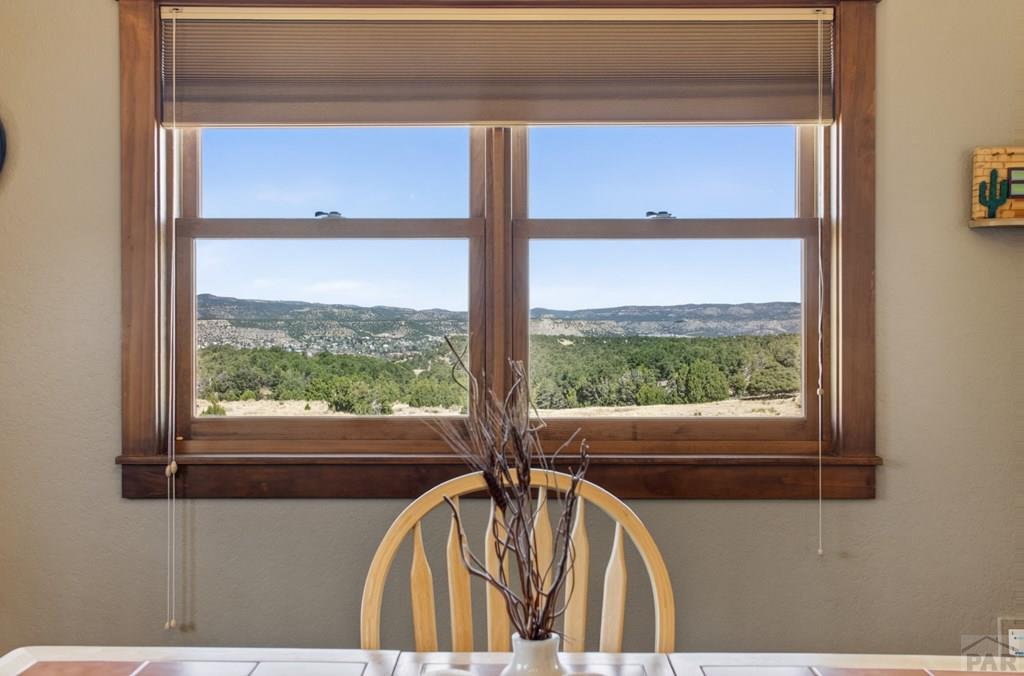 415 Riata Drive Trinidad, CO 81082 - Photo 36 of 61 a view of a balcony with a couple of cars parked from a window