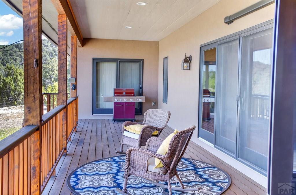 415 Riata Drive Trinidad, CO 81082 - Photo 39 of 61 a view of a hallway with wooden floor and windows