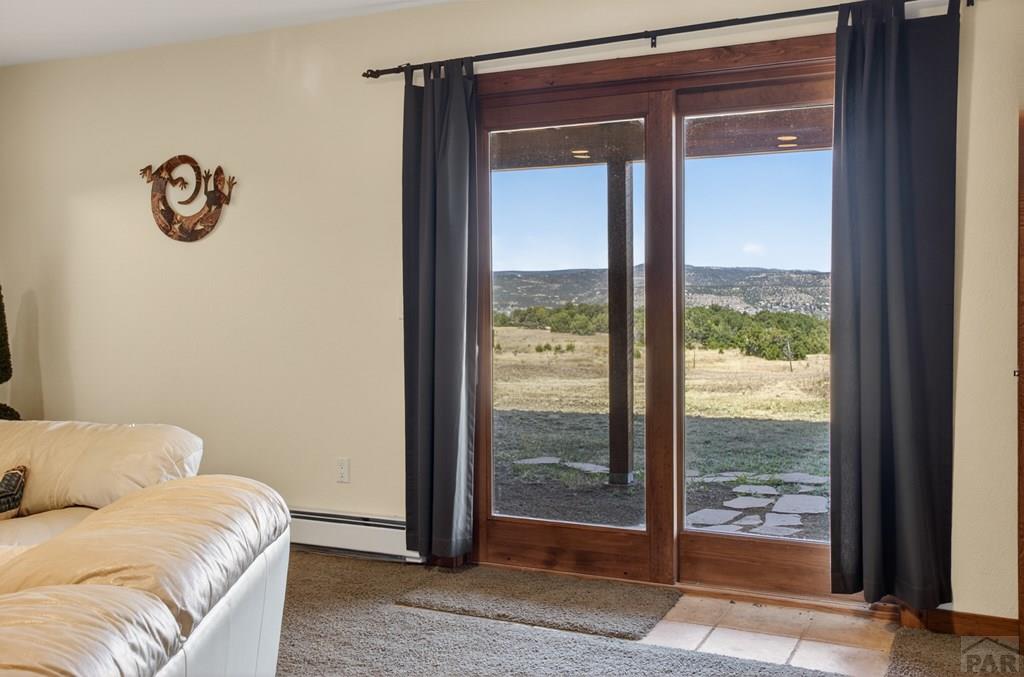 415 Riata Drive Trinidad, CO 81082 - Photo 47 of 61 a bedroom with a bed and a window