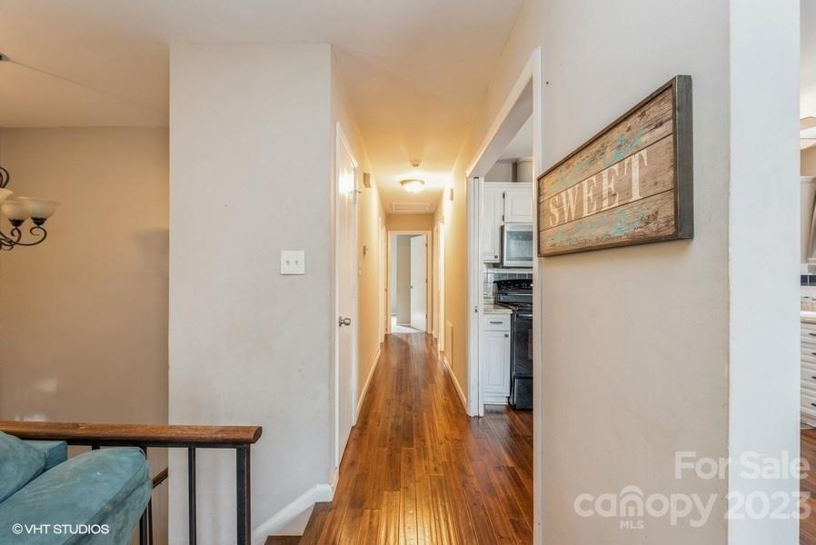 6925 Random Place Charlotte, NC 28215 - Photo 11 of 31 a view of hallway with wooden floor