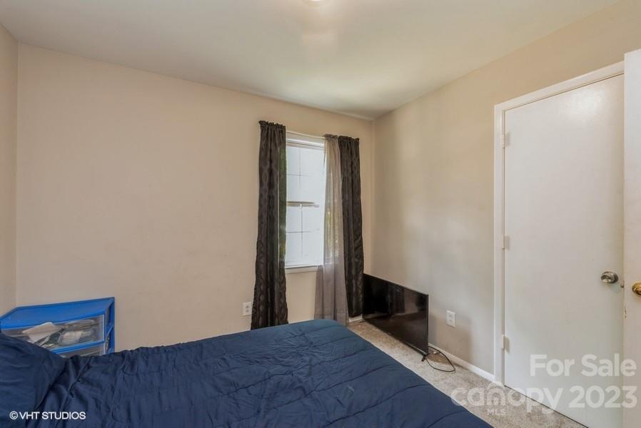 6925 Random Place Charlotte, NC 28215 - Photo 17 of 31 a view of a room with wooden floor and wardrobe