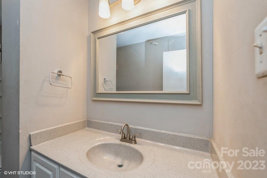 6925 Random Place Charlotte, NC 28215 - Photo 18 of 31 a bathroom with a sink and a mirror