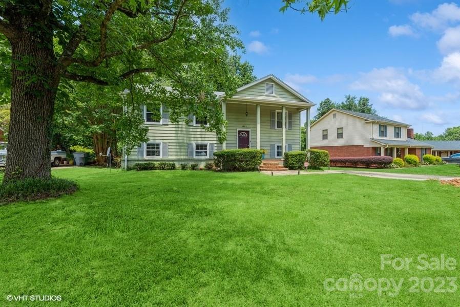 6925 Random Place Charlotte, NC 28215 - Photo 2 of 31 a front view of house with yard and green space