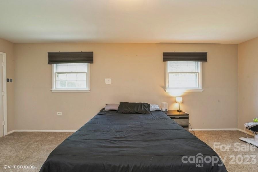 6925 Random Place Charlotte, NC 28215 - Photo 21 of 31 a bedroom with a bed and window
