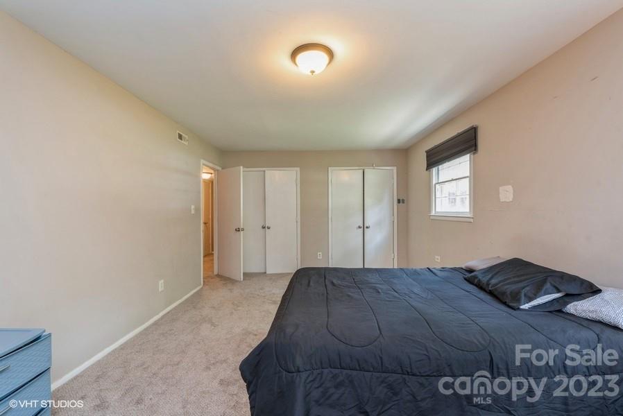 6925 Random Place Charlotte, NC 28215 - Photo 22 of 31 a bedroom with a bed and a window