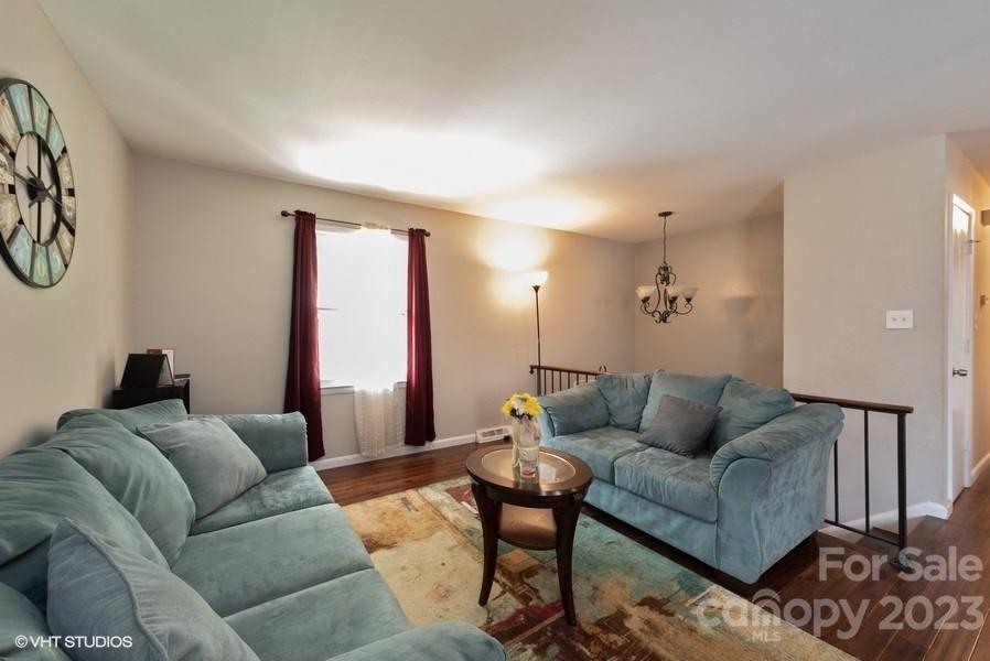 6925 Random Place Charlotte, NC 28215 - Photo 4 of 31 a living room with furniture and a couch