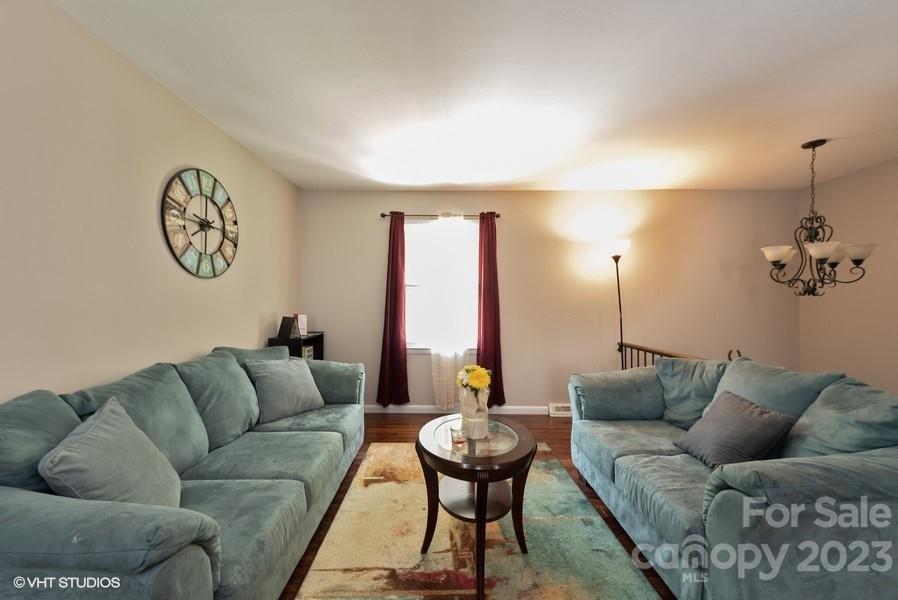 6925 Random Place Charlotte, NC 28215 - Photo 5 of 31 a living room with furniture and a large window