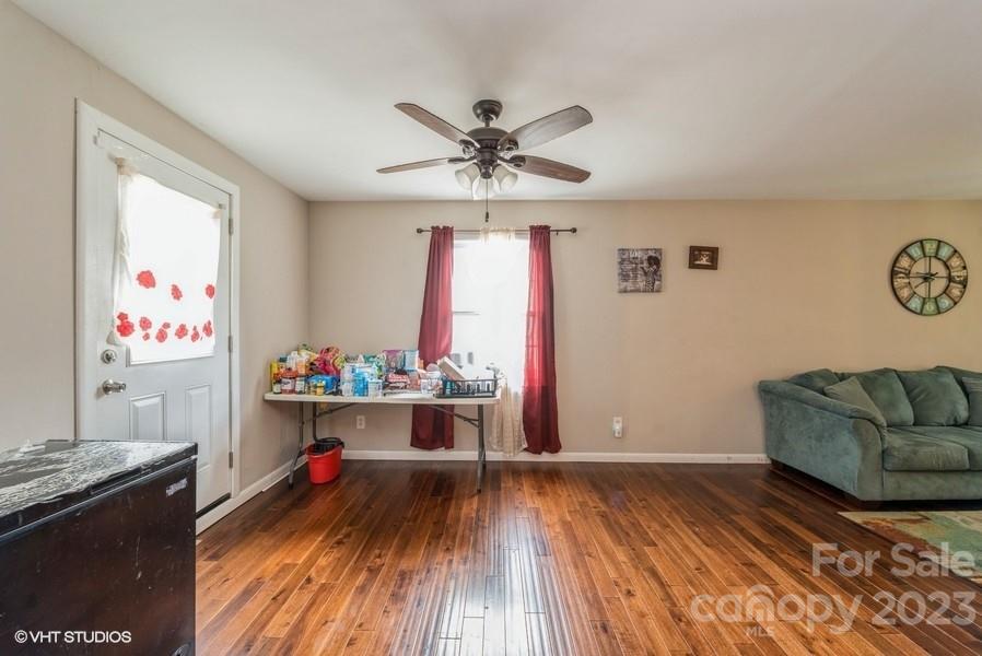 6925 Random Place Charlotte, NC 28215 - Photo 10 of 31 a living room with furniture and a wooden floor