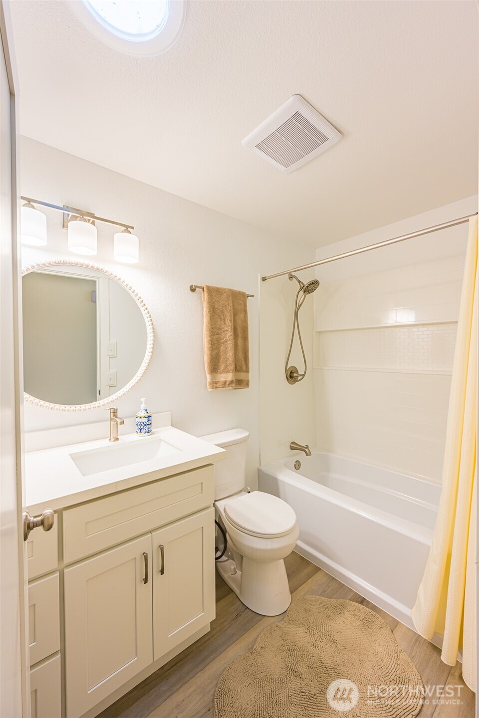 440 Spring Road Port Angeles, WA 98362 - Photo 14 of 21 a bathroom with a granite countertop sink toilet a mirror and shower