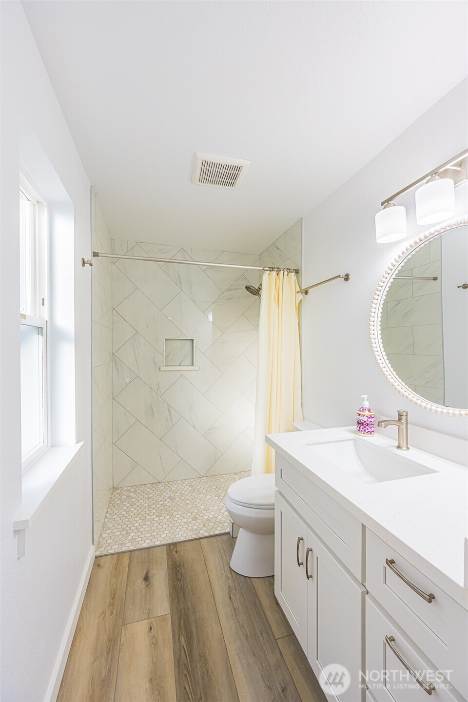 440 Spring Road Port Angeles, WA 98362 - Photo 17 of 21 a bathroom with a double vanity sink toilet and a mirror