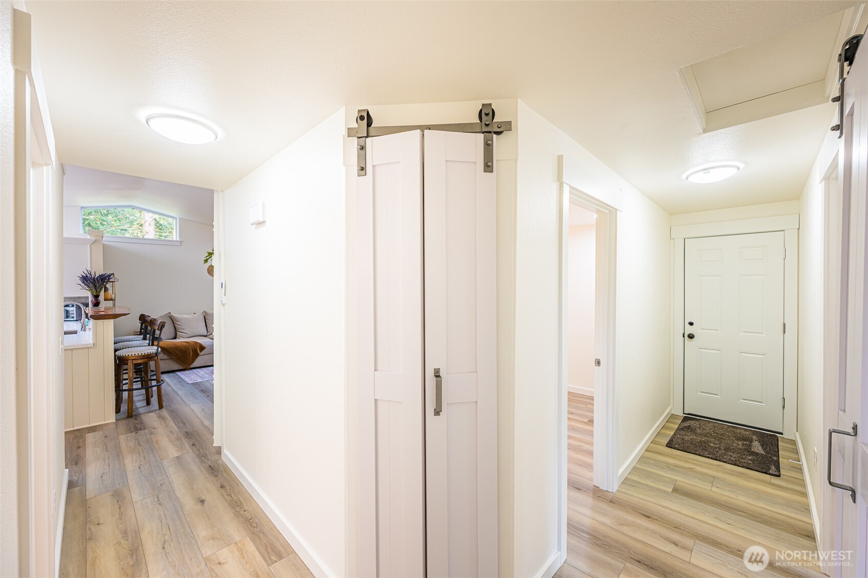 440 Spring Road Port Angeles, WA 98362 - Photo 18 of 21 a view of a bedroom with wooden floor and furniture