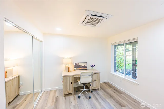 a workspace with furniture and a window