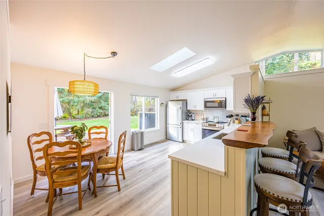 a view of a dining room with furniture window and outside view