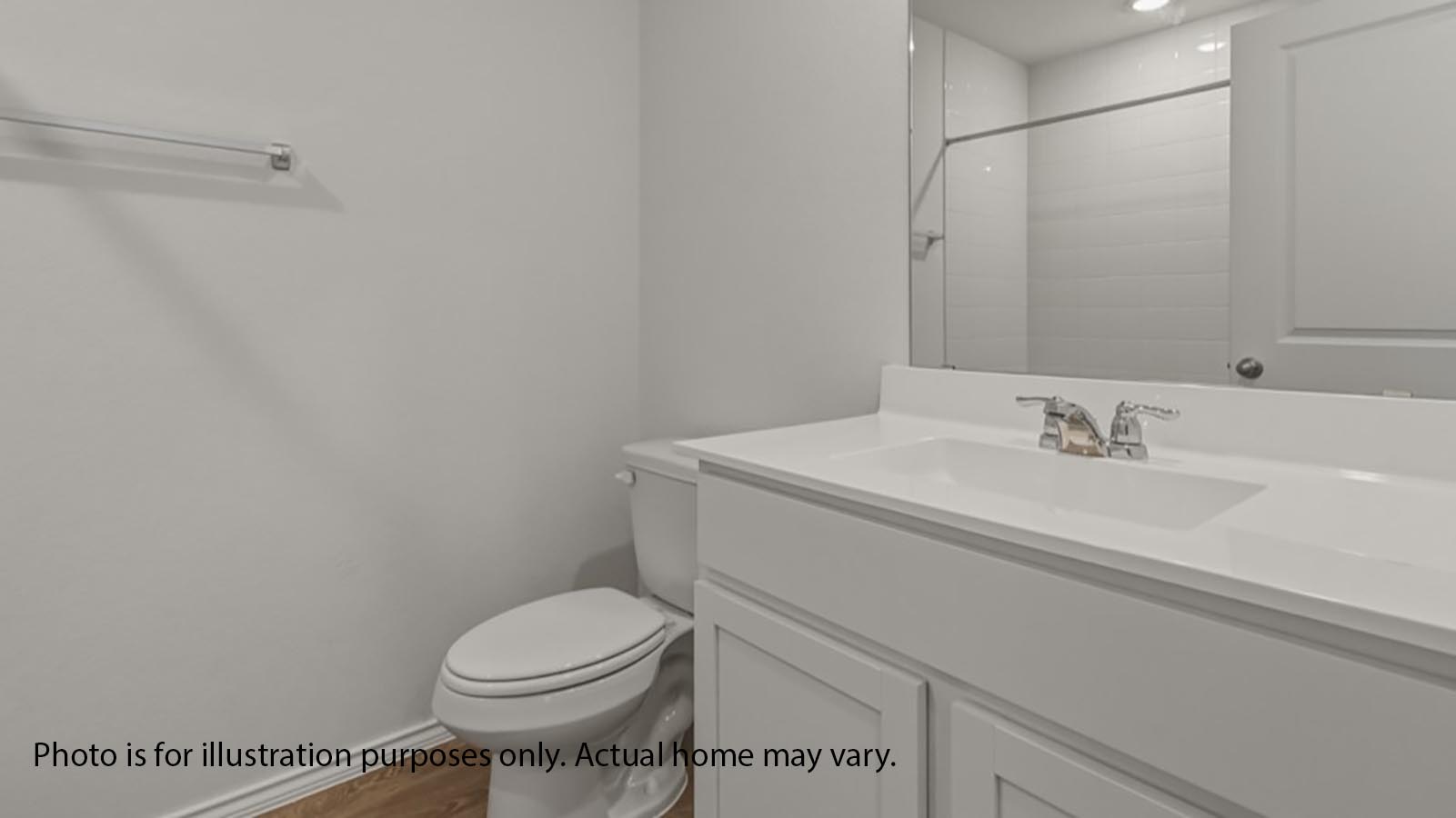 1205 Celosia Loop Kyle, TX 78640 - Photo 21 of 25 a bathroom with a sink a toilet and a mirror