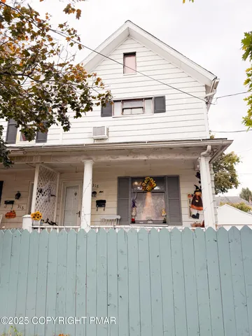 a front view of a house with a garage
