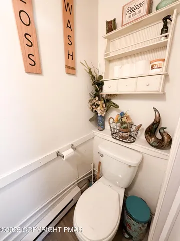 a bathroom with a toilet and a sink