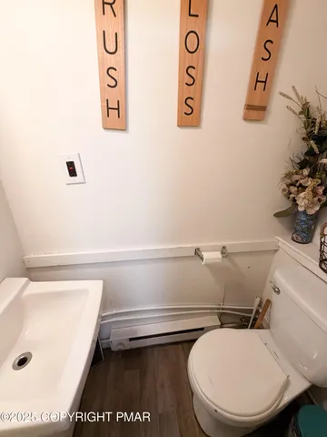 a bathroom with a toilet and a sink