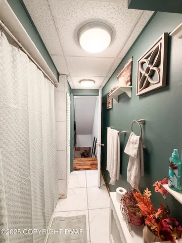 a bathroom with a sink mirror and vanity