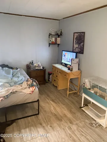 a bedroom with a bed and furniture