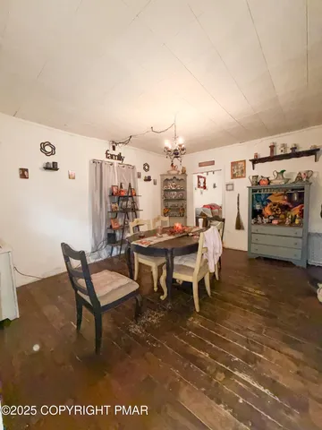 a view of a chairs and table in a room