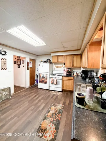 a view of a kitchen with furniture and a window