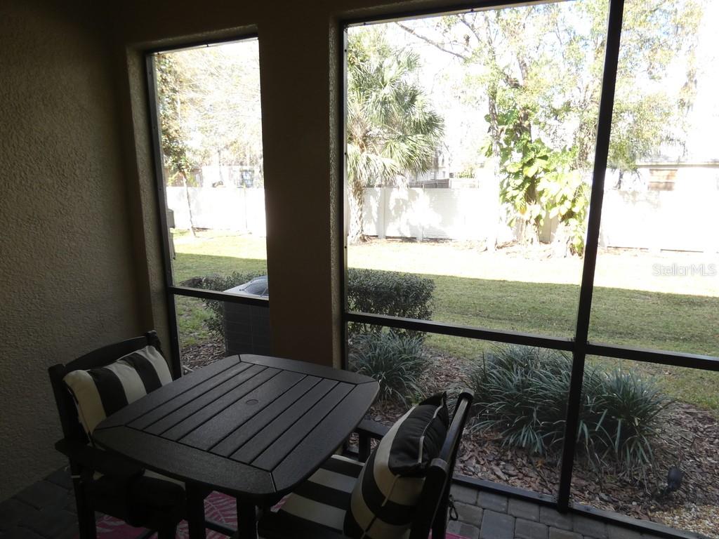 1505 Sunset Wind Loop Oldsmar, FL 34677 - Photo 17 of 36 a view of a room with furniture and wooden floor