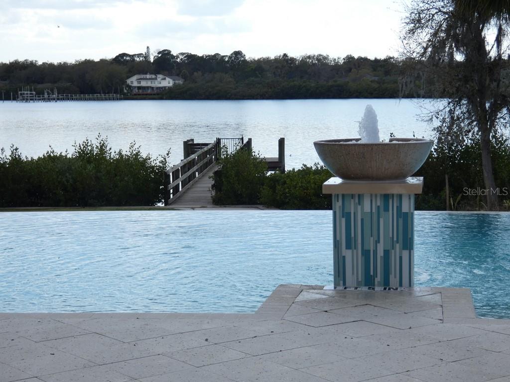 1505 Sunset Wind Loop Oldsmar, FL 34677 - Photo 2 of 36 a view of a lake from a yard