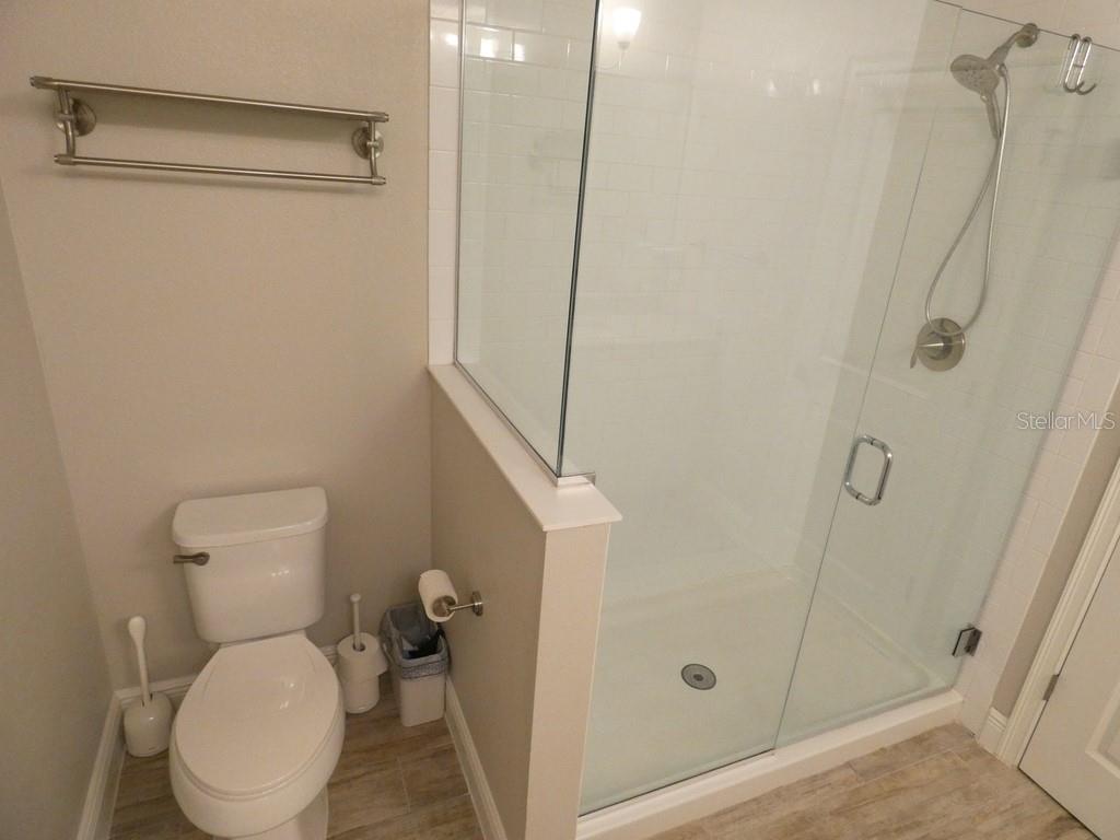 1505 Sunset Wind Loop Oldsmar, FL 34677 - Photo 22 of 36 a bathroom with a toilet and a shower