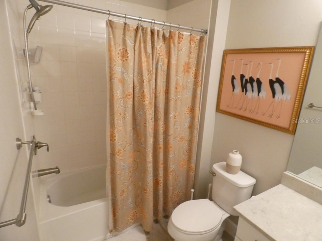 1505 Sunset Wind Loop Oldsmar, FL 34677 - Photo 26 of 36 a white toilet sitting next to a bath tub
