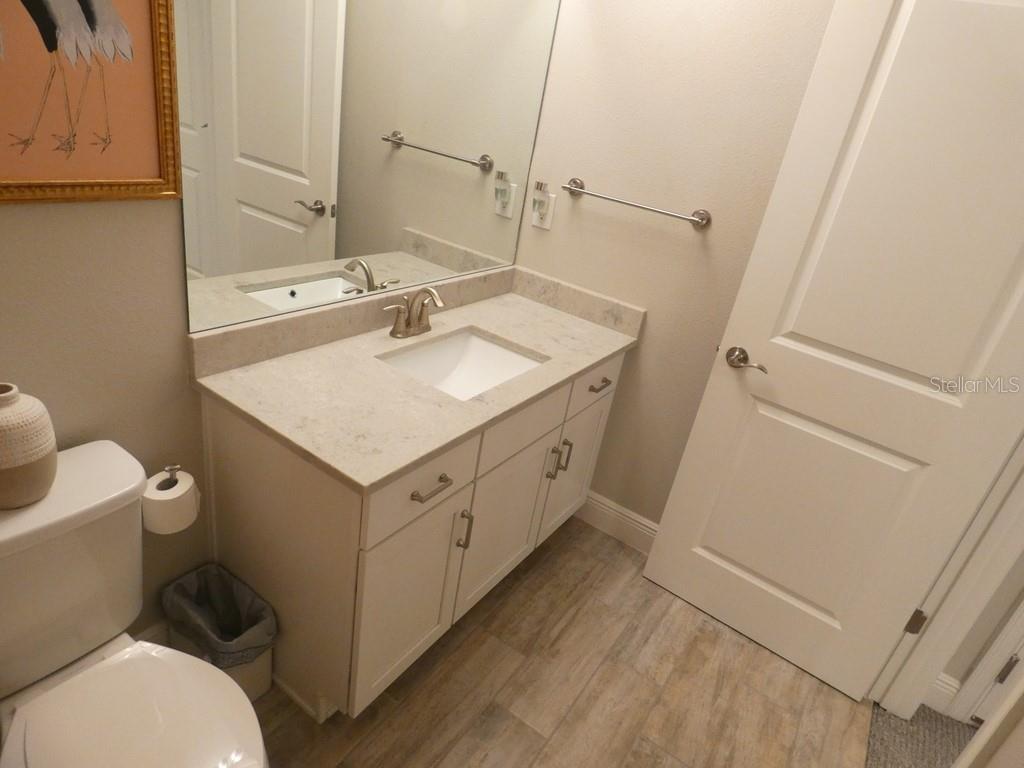 1505 Sunset Wind Loop Oldsmar, FL 34677 - Photo 27 of 36 a bathroom with a sink toilet and mirror