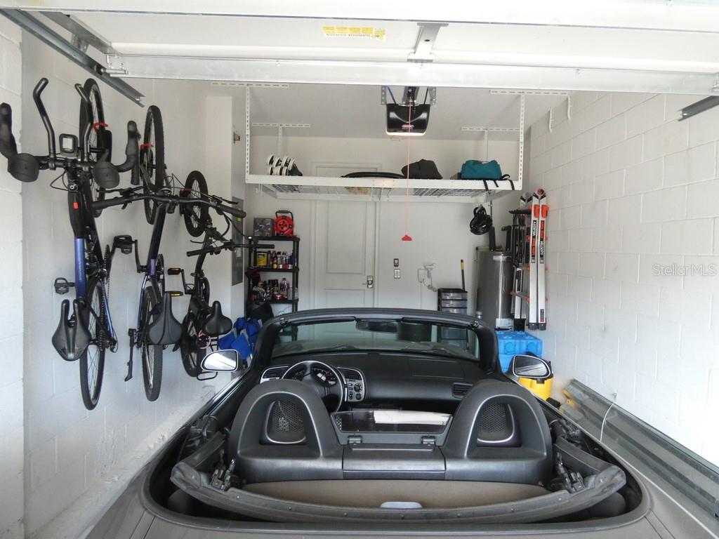 1505 Sunset Wind Loop Oldsmar, FL 34677 - Photo 35 of 36 a utility room with sink dryer and bicycles