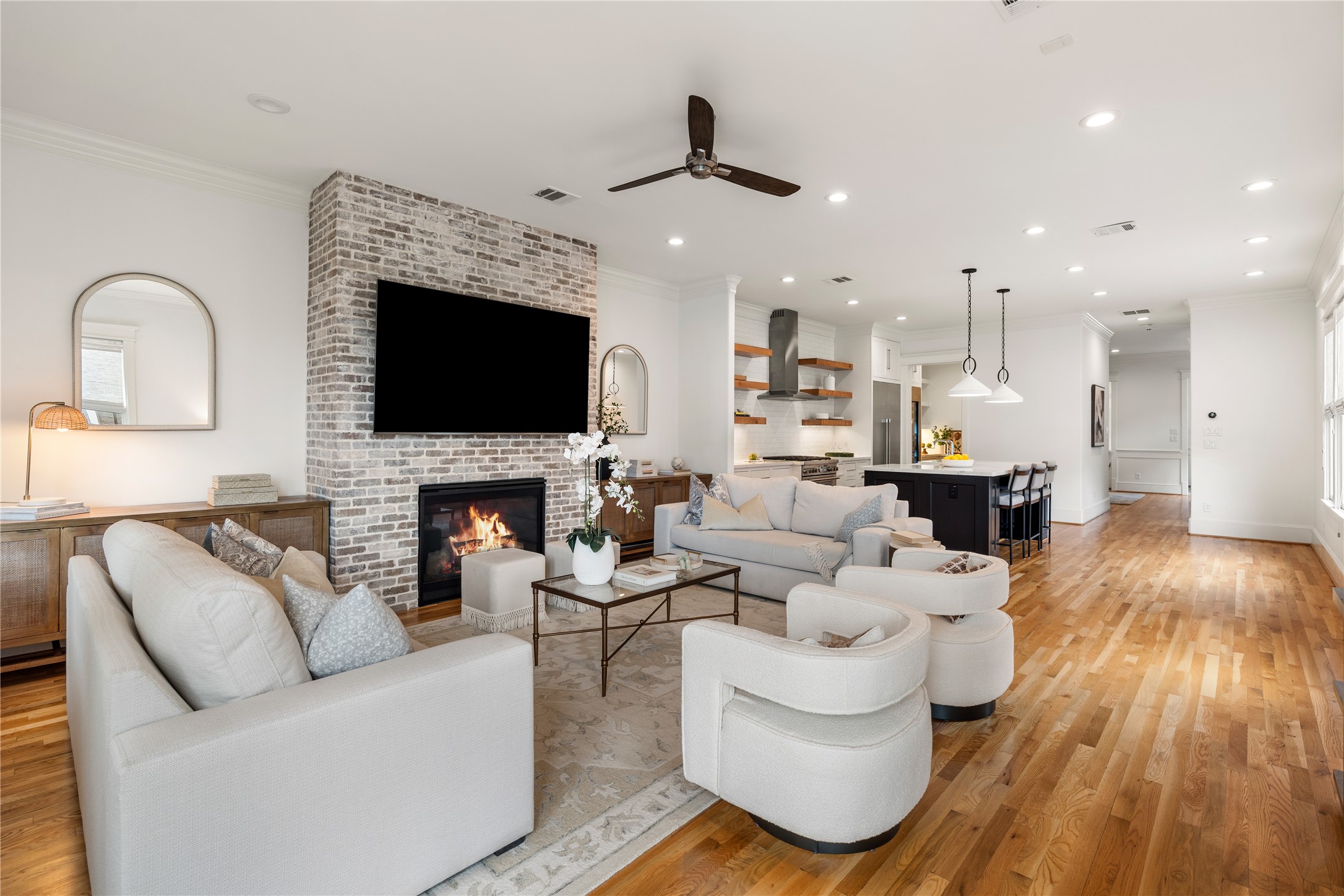 925 Tulane Street, Unit A Houston, TX 77008 - Photo 2 of 49 Throughout the 3,875-square-foot residence, ceilings soar 10 feet tall over designer lighting, refinished white oak floors, elegant millwork, and abundant windows with custom Roman shades.