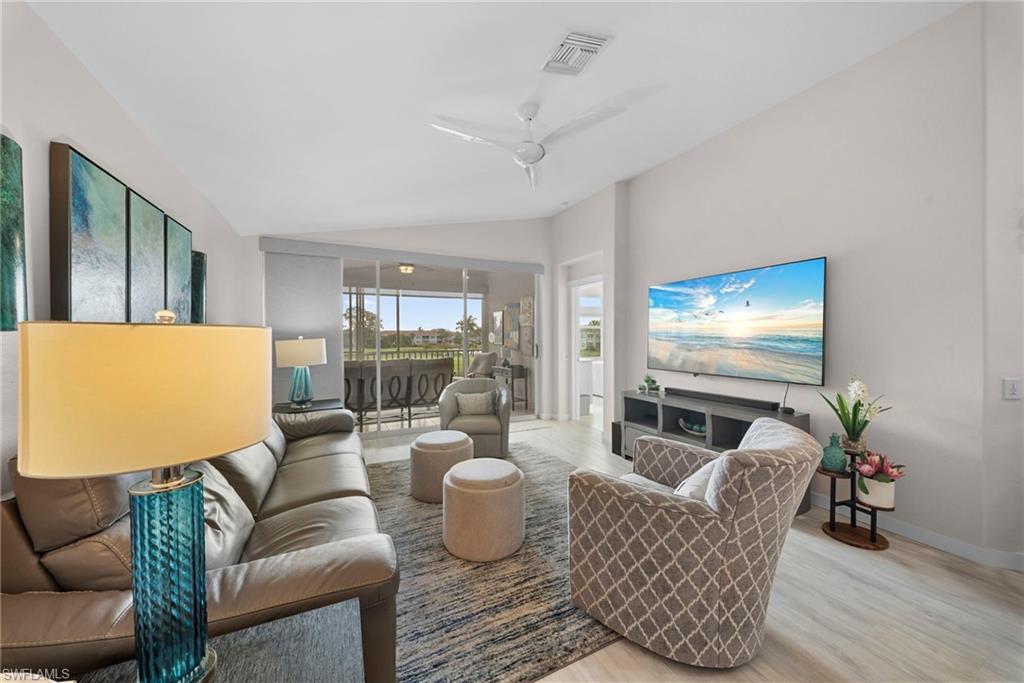 9231 Spring Run Boulevard, Unit 2109 Estero, FL 34135 - Photo 11 of 35 Open living room with golf course view