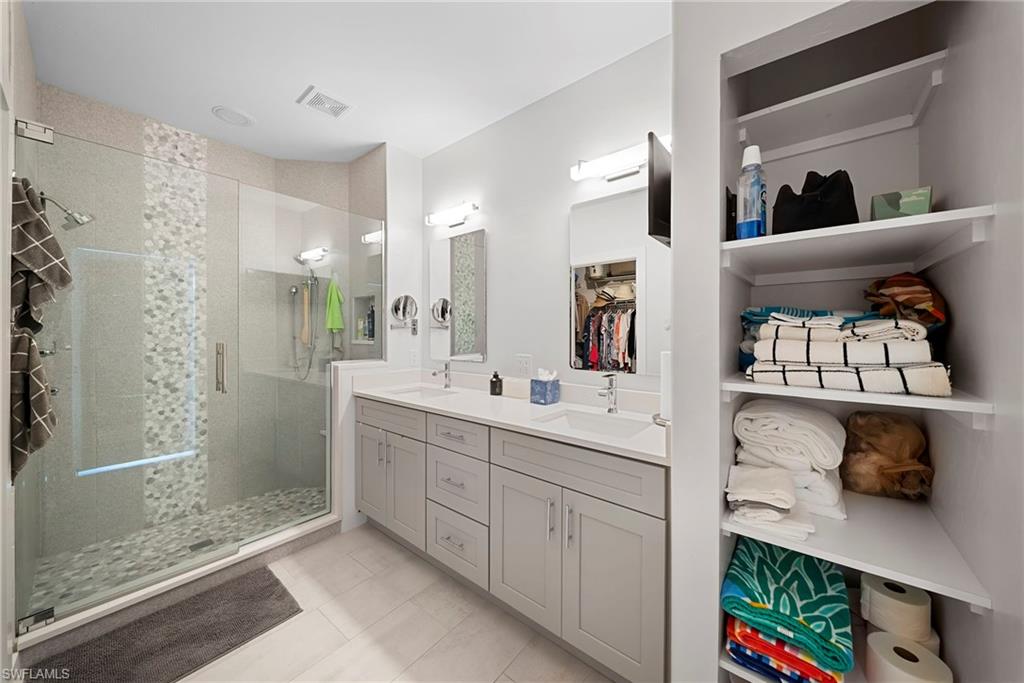 9231 Spring Run Boulevard, Unit 2109 Estero, FL 34135 - Photo 19 of 35 Master bathroom vanity and shower