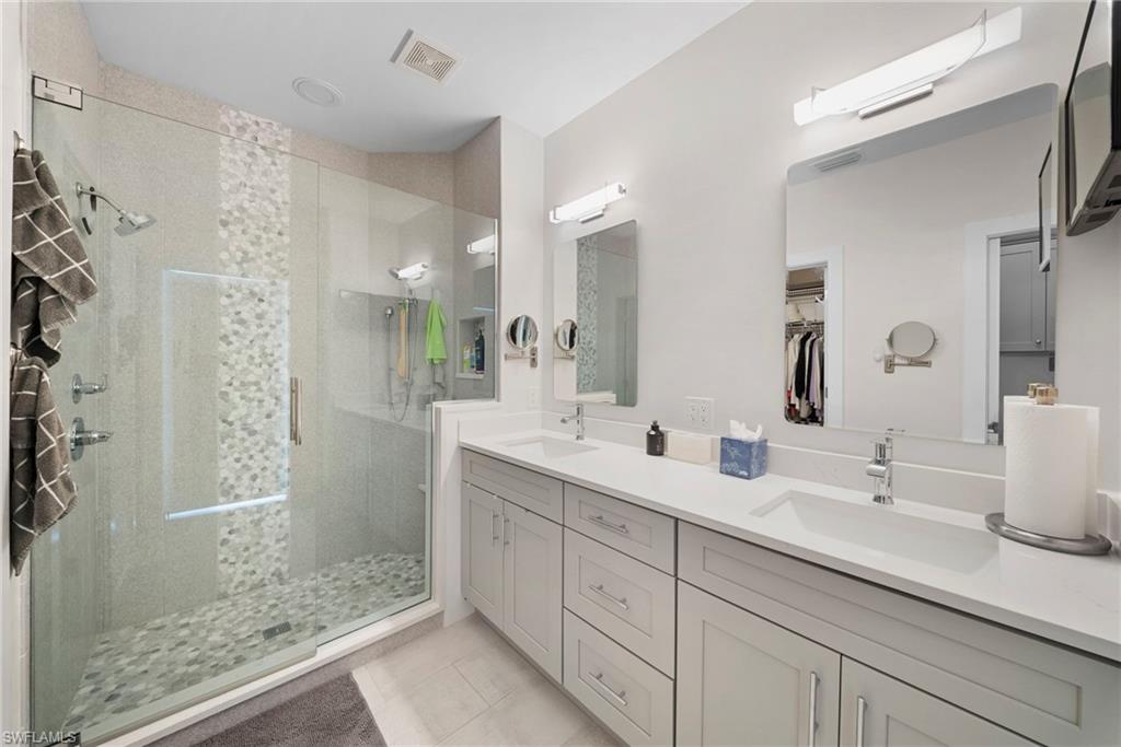 9231 Spring Run Boulevard, Unit 2109 Estero, FL 34135 - Photo 20 of 35 Master bathroom vanity and shower