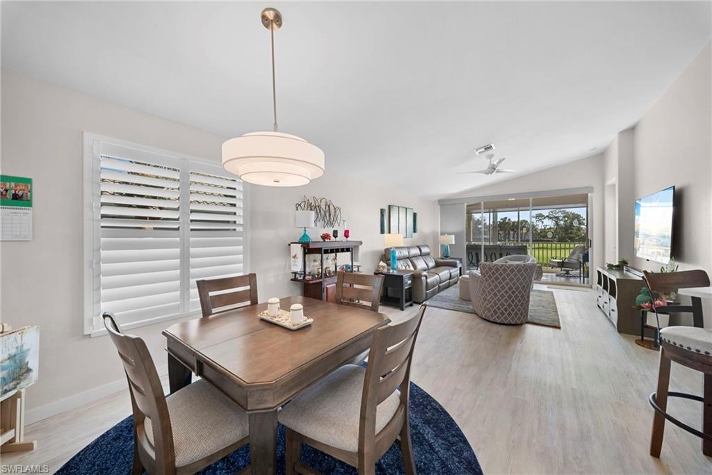 9231 Spring Run Boulevard, Unit 2109 Estero, FL 34135 - Photo 5 of 35 Dining room featuring lofted ceiling, light wood-style flooring, and ceiling fan