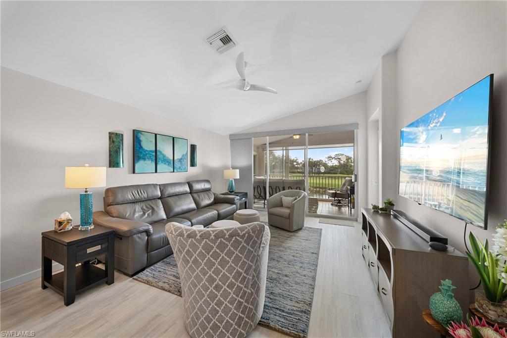 9231 Spring Run Boulevard, Unit 2109 Estero, FL 34135 - Photo 10 of 35 Open living room with golf course view