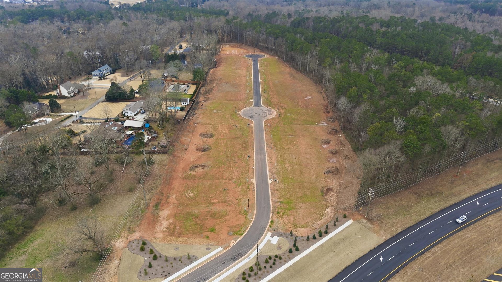 Hwy 166 W Maple Street Carrollton, GA 30117 - Photo 2 of 12 an aerial view of a house with a yard