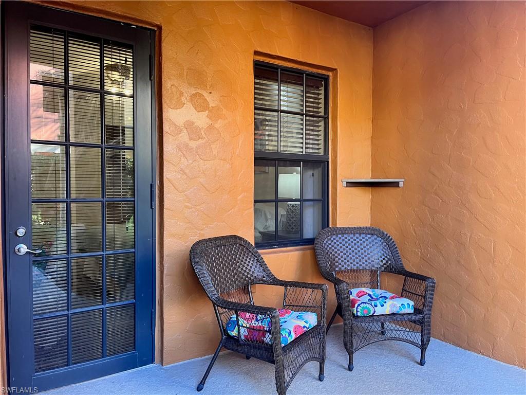 9092 Chula Vista Street, Unit 11003 Naples, FL 34113 - Photo 18 of 42 a living room with furniture