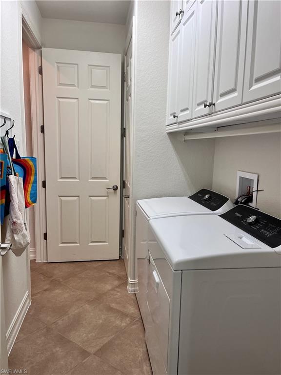 9092 Chula Vista Street, Unit 11003 Naples, FL 34113 - Photo 19 of 42 a utility room with dryer and washer