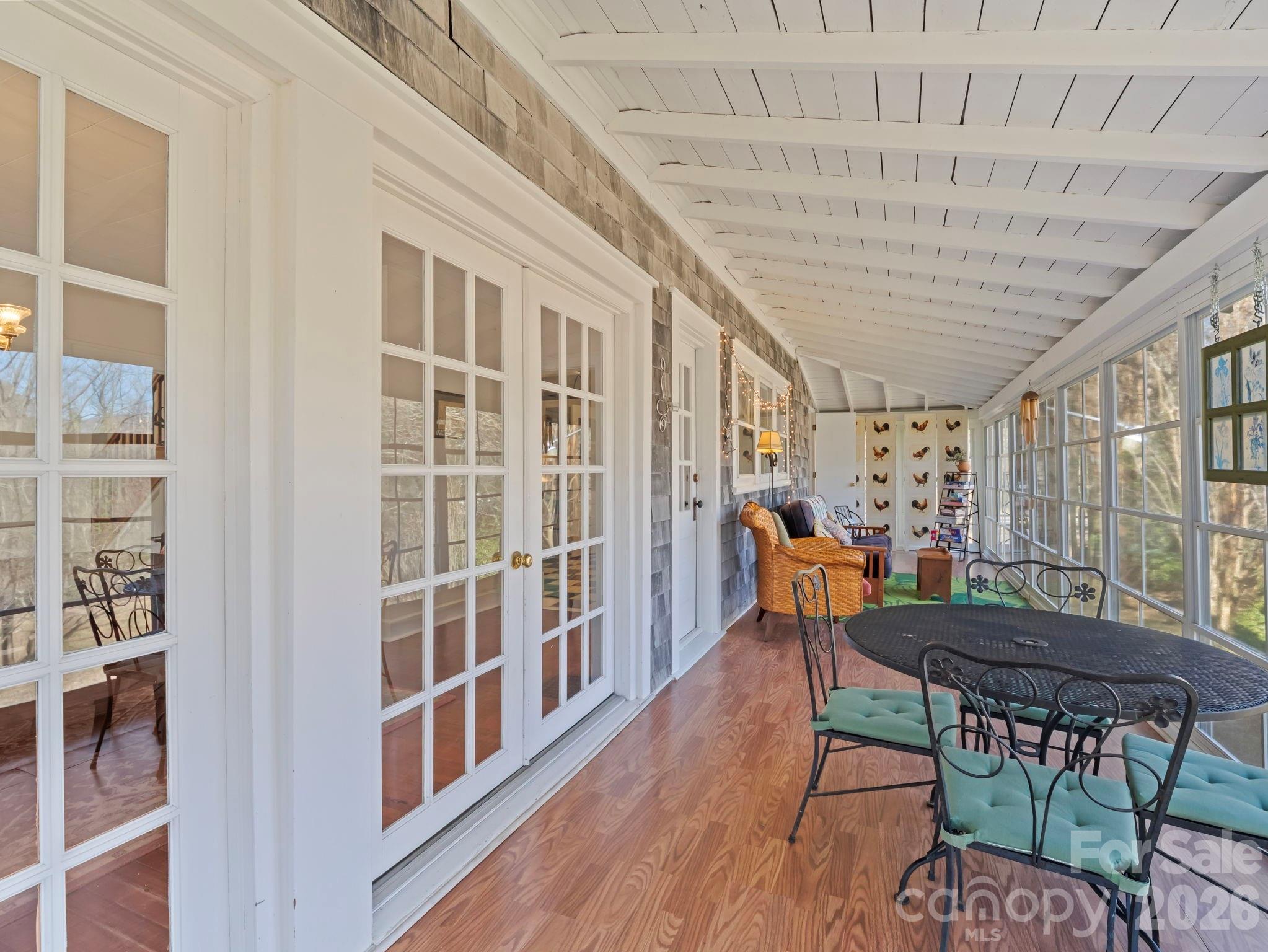 439 Lockhart Road Tryon, NC 28782 - Photo 14 of 43 a view of a dining room with furniture window and wooden floor