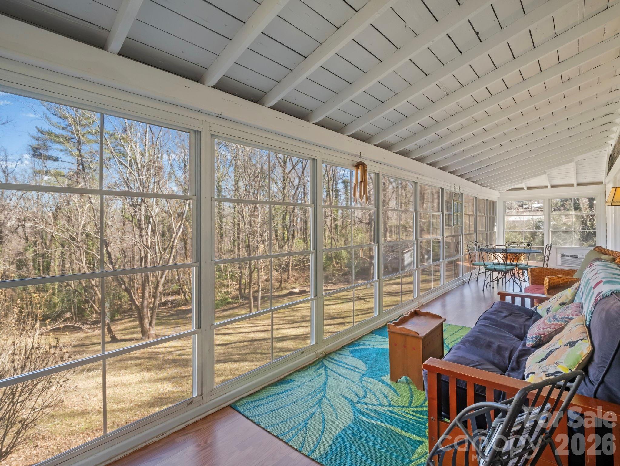 439 Lockhart Road Tryon, NC 28782 - Photo 15 of 43 a living room with furniture next to a large window