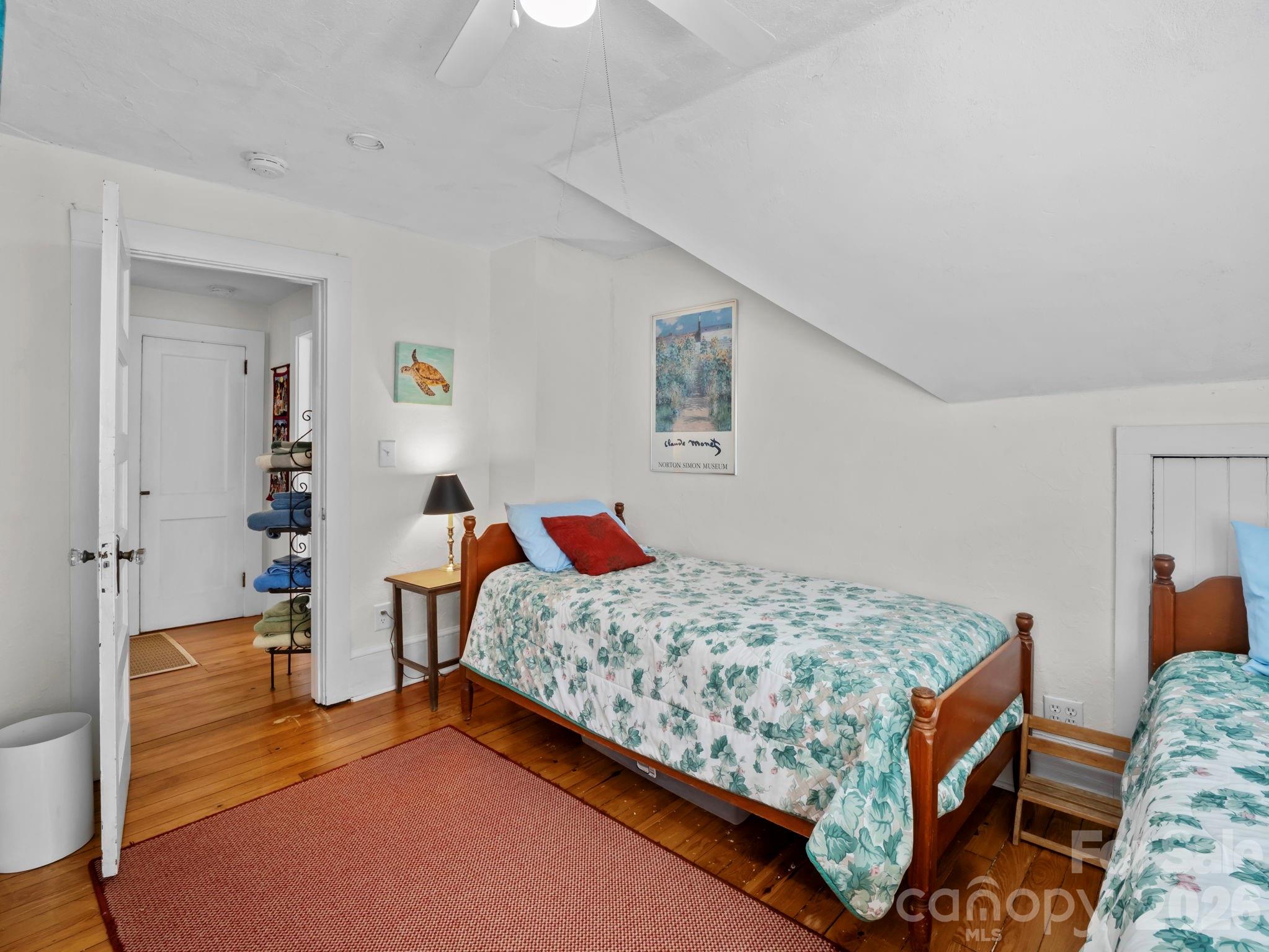 439 Lockhart Road Tryon, NC 28782 - Photo 20 of 43 a bedroom with a bed and dresser