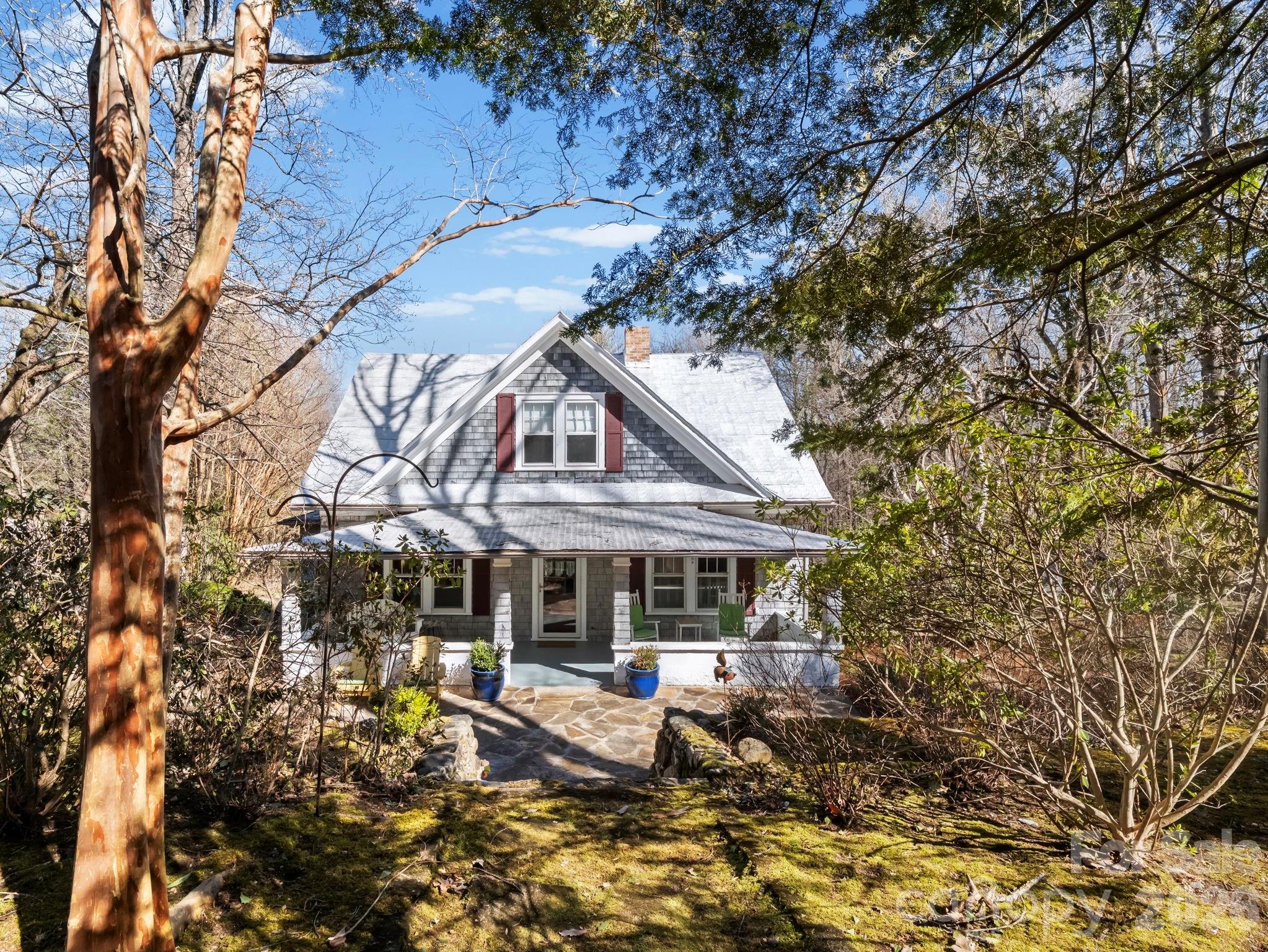 439 Lockhart Road Tryon, NC 28782 - Photo 2 of 43 a front view of a house with garden