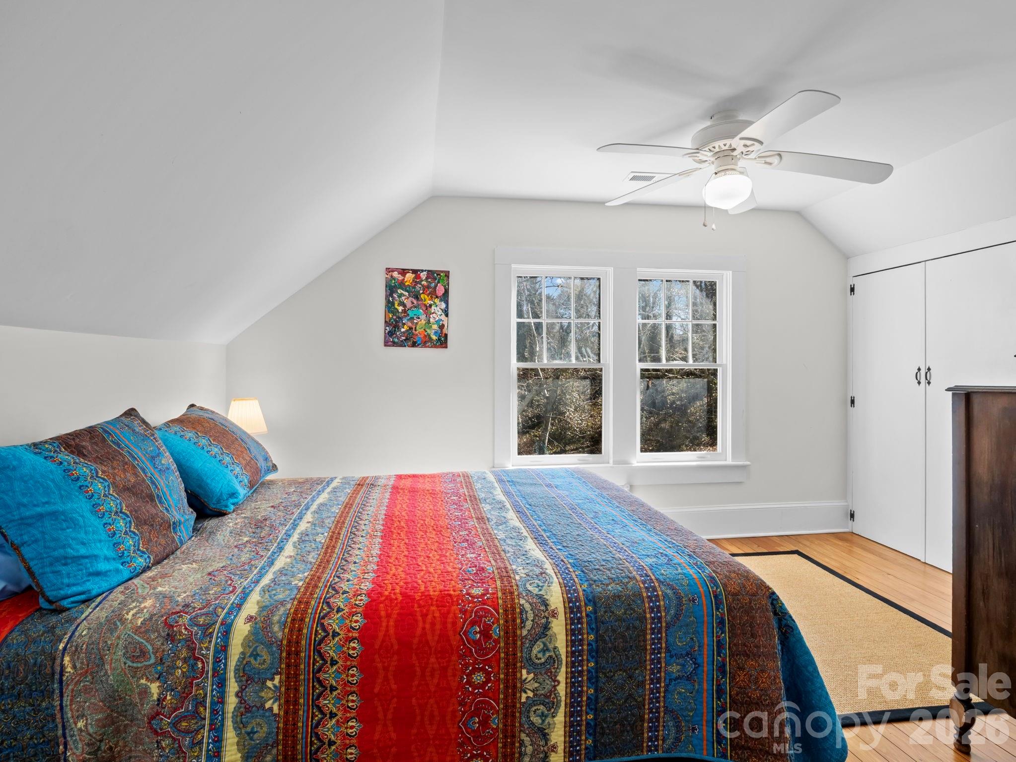 439 Lockhart Road Tryon, NC 28782 - Photo 21 of 43 a bedroom with a bed and a window