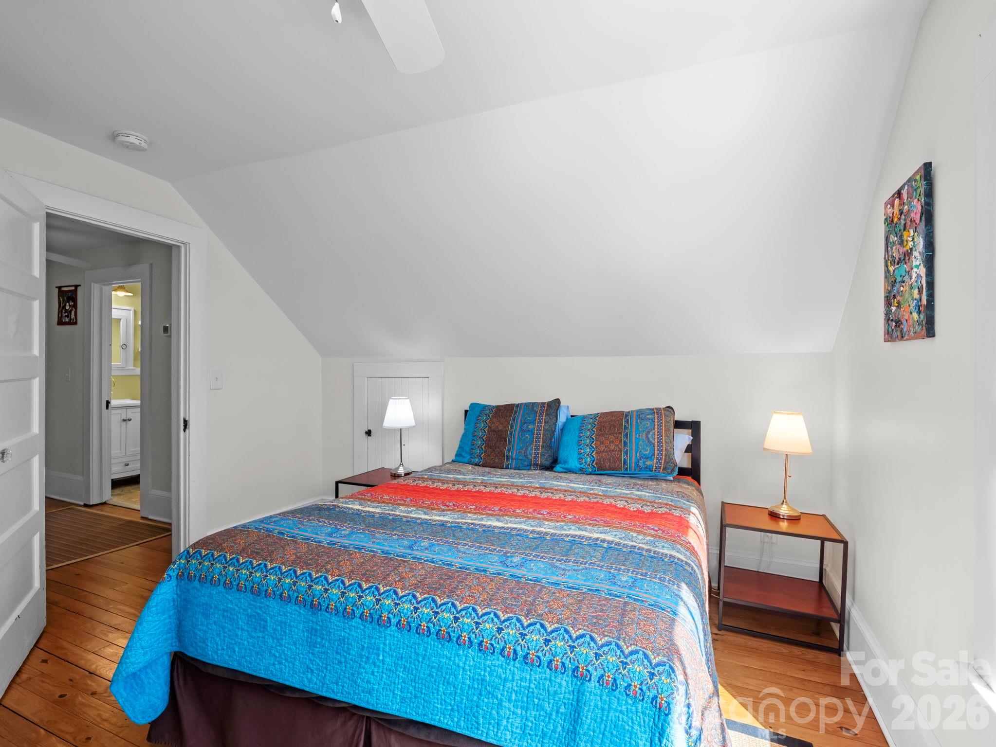 439 Lockhart Road Tryon, NC 28782 - Photo 22 of 43 a bedroom with a bed and a table