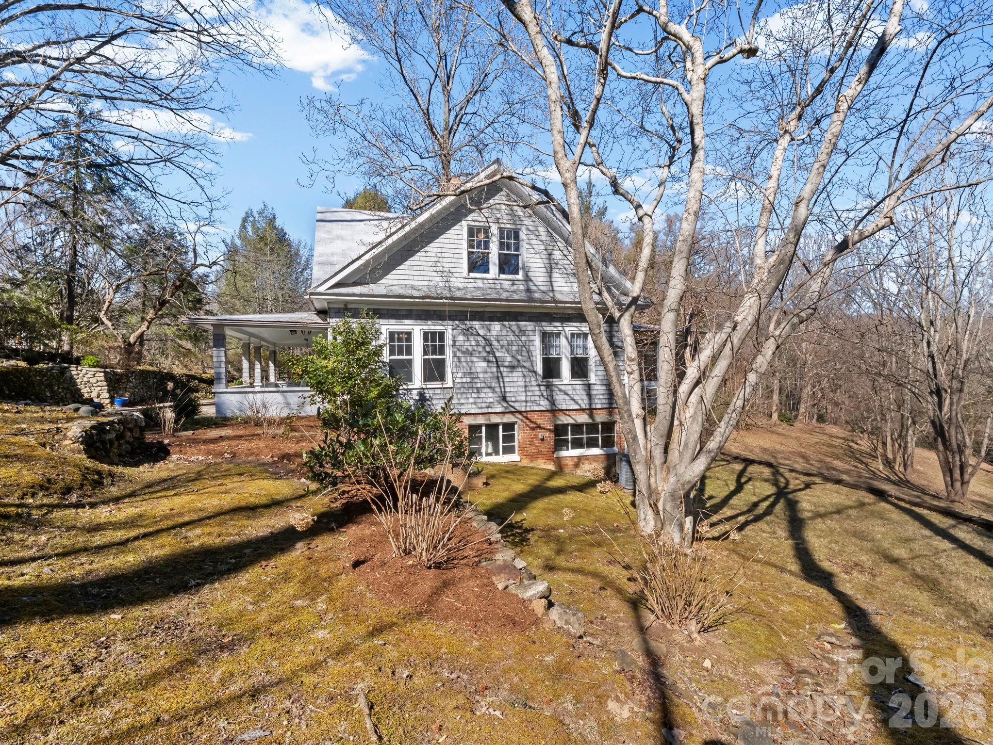 439 Lockhart Road Tryon, NC 28782 - Photo 29 of 43 a view of a swimming pool with some trees in the background