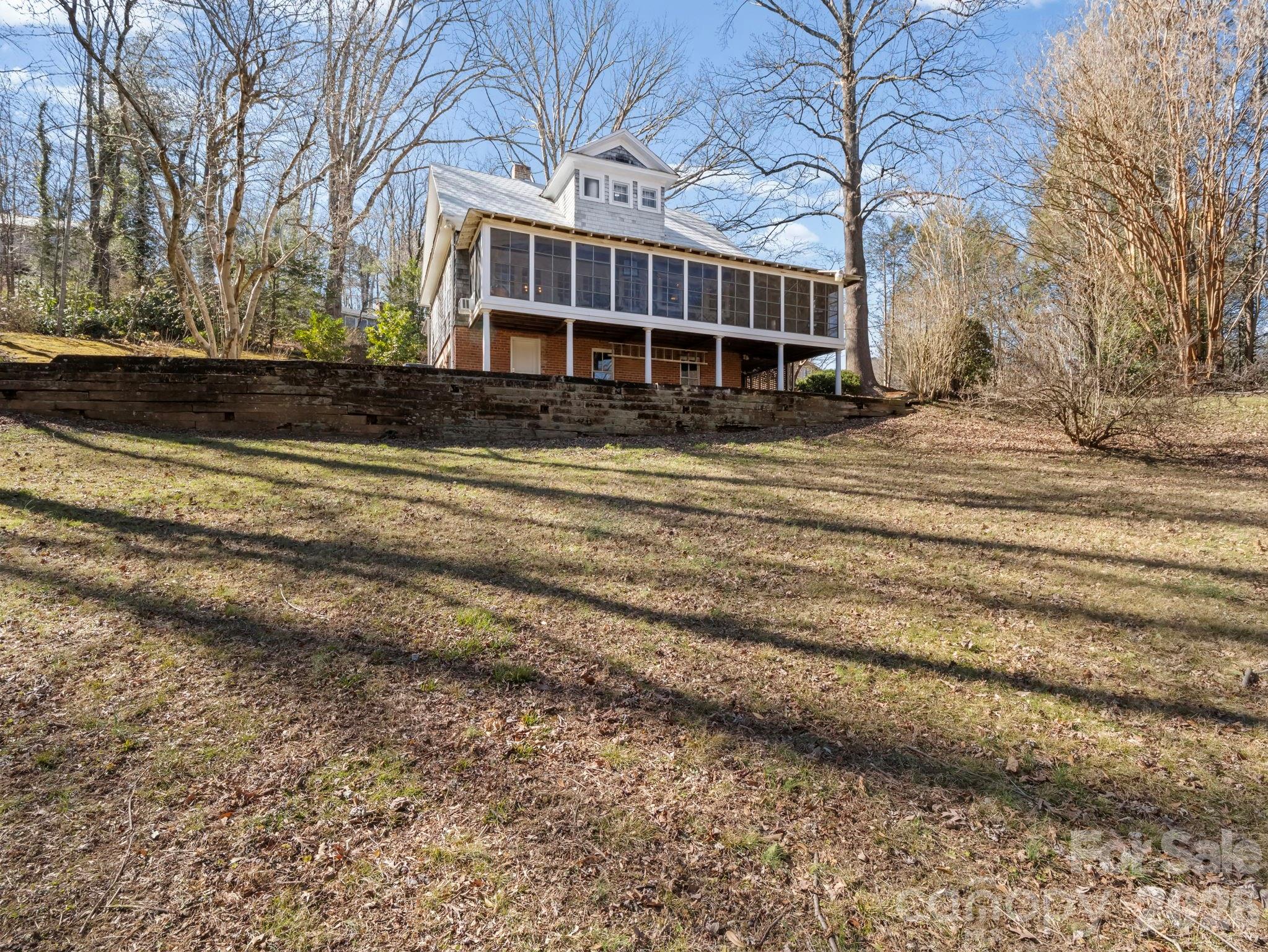 439 Lockhart Road Tryon, NC 28782 - Photo 31 of 43 a view of a house with a yard