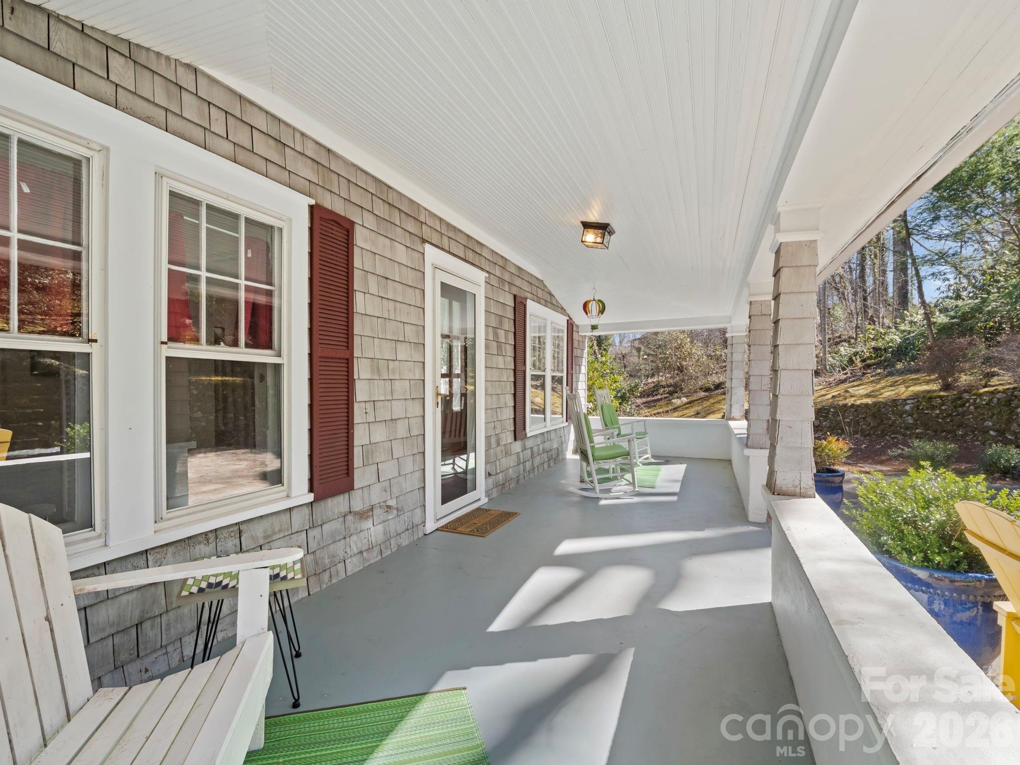 439 Lockhart Road Tryon, NC 28782 - Photo 32 of 43 a view of a house with a porch